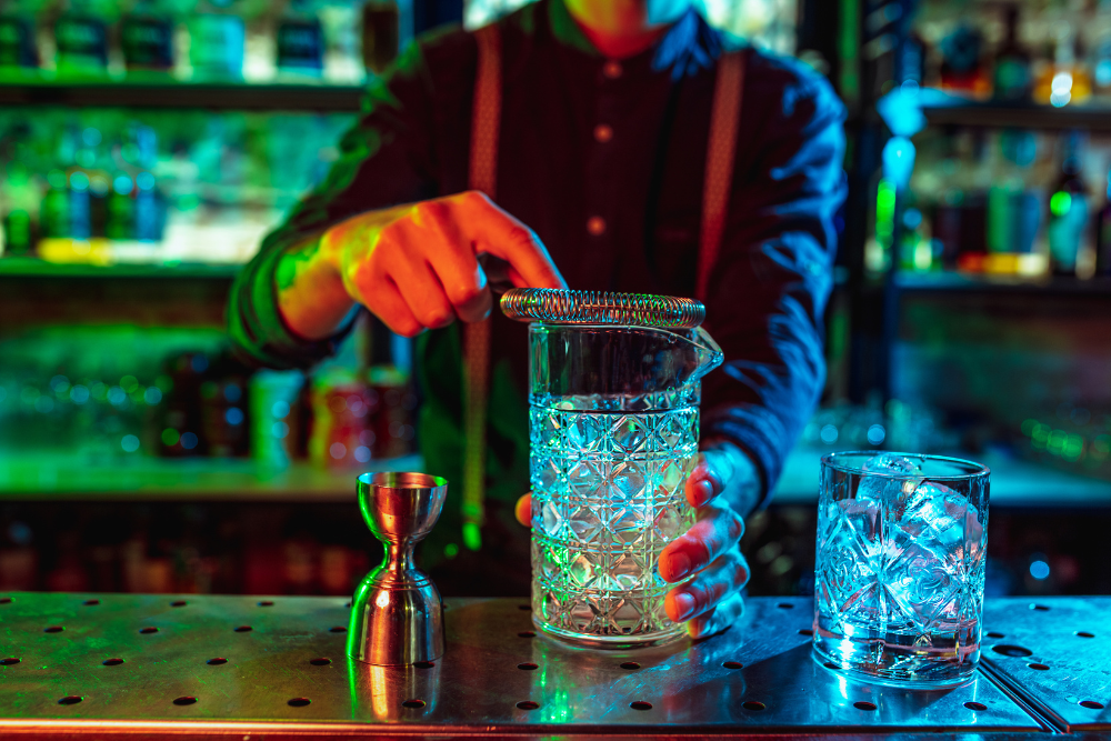 Bartender preparing a cocktail. NH bars are likely to face tougher penalties for overserving alcohol-related injuries