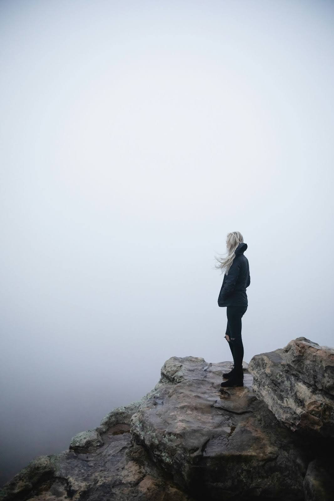 Woman on jagged mountain