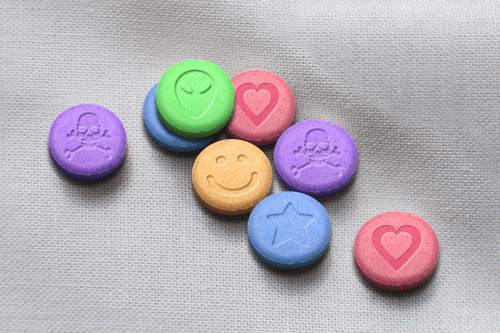 several colorful ecstasy pills