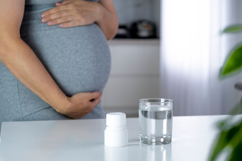 Pregnant woman with bottle of pills possibly containing fentanyl, risking Fentanyl Baby Syndrome in her child